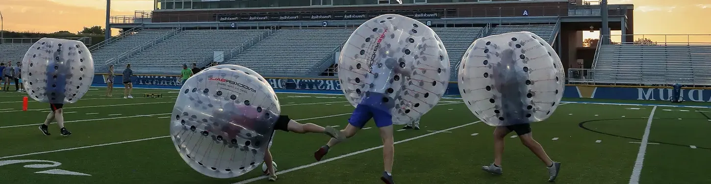 students playing an intramural game in giant inflatable balls